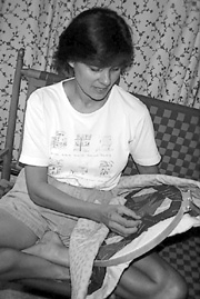 Gail Martinez sews