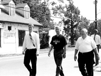 Mayor Dan Hartley leads a delegation of politicians, including Gov. Parris Glendening, center.